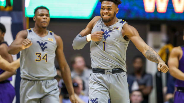 West Virginia Mountaineers forward Derek Culver (1) celebrates after basket during the first half against the TCU Horned Frogs at WVU Coliseum.